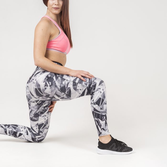 side-view-sporty-woman-sitting-one-knee